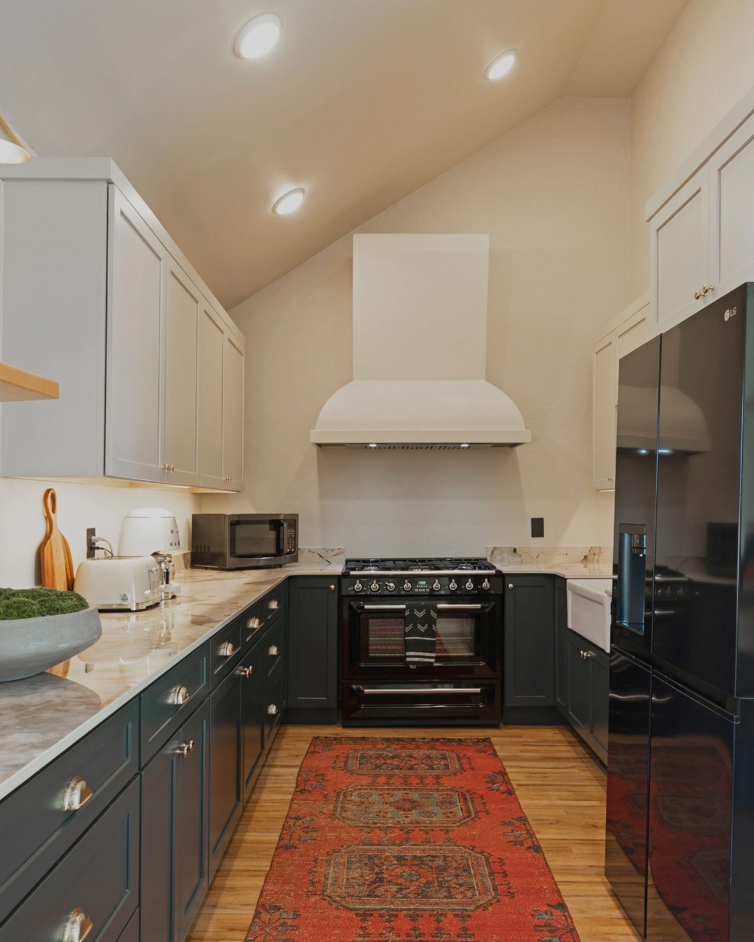 Luxury kitchen remodel with marble countertops and dark cabinets